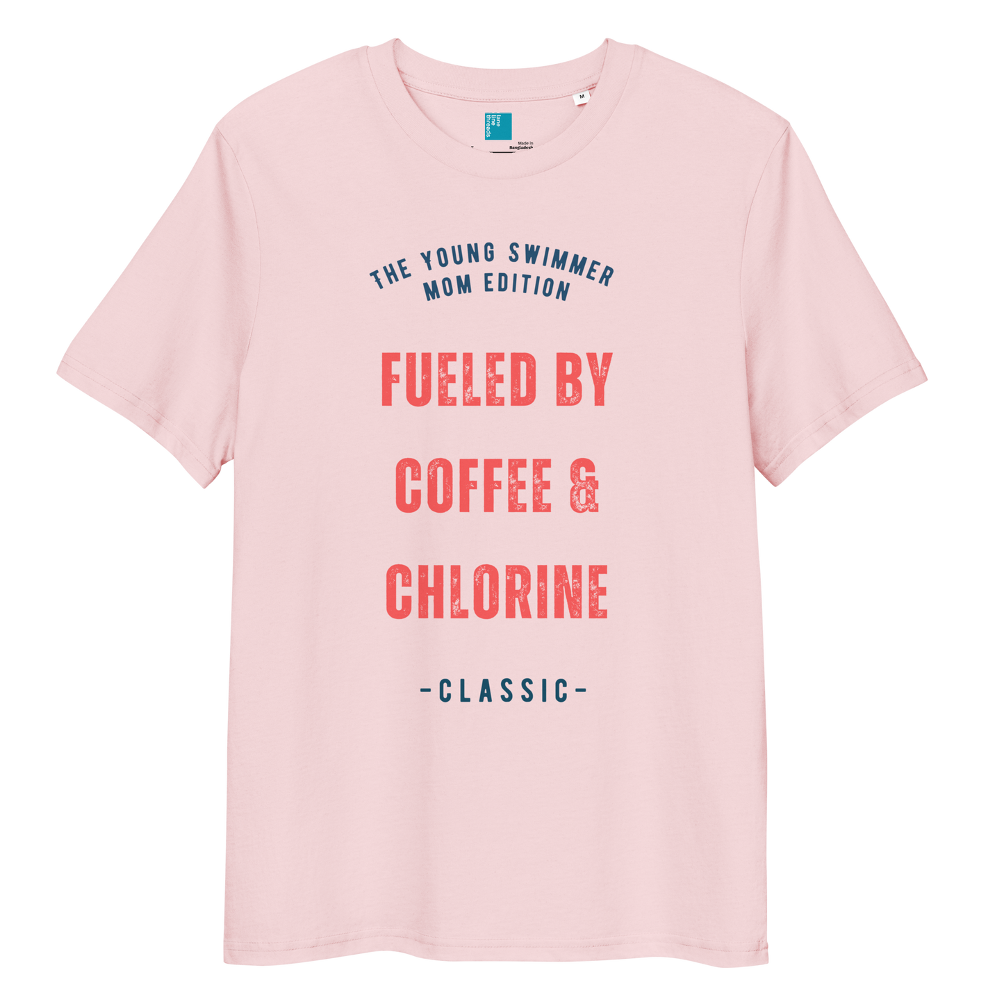Cotton pink organic cotton swim mom t-shirt with red and navy text: “Fueled by Coffee & Chlorine – The Young Swimmer Mom Edition – Classic.”
