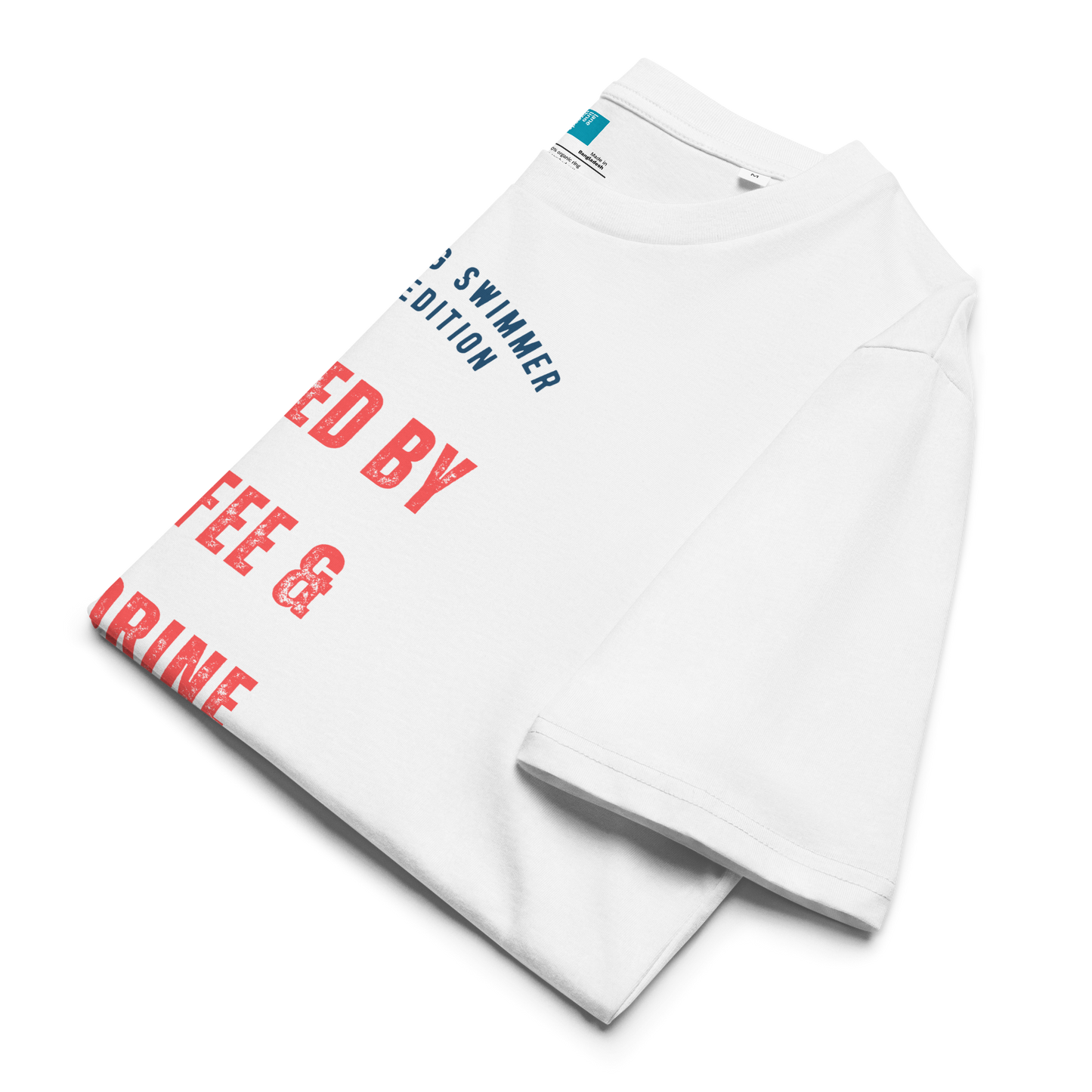 White organic cotton swim mom t-shirt with red and navy text: “Fueled by Coffee & Chlorine – The Young Swimmer Mom Edition – Classic.” folded