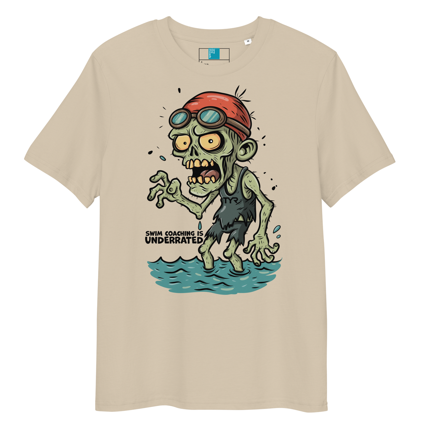 Beige funny Halloween swimming coach shirt with cartoon zombie coach in red swimming cap and goggles, text reads ‘Swim Coaching is Underrated’