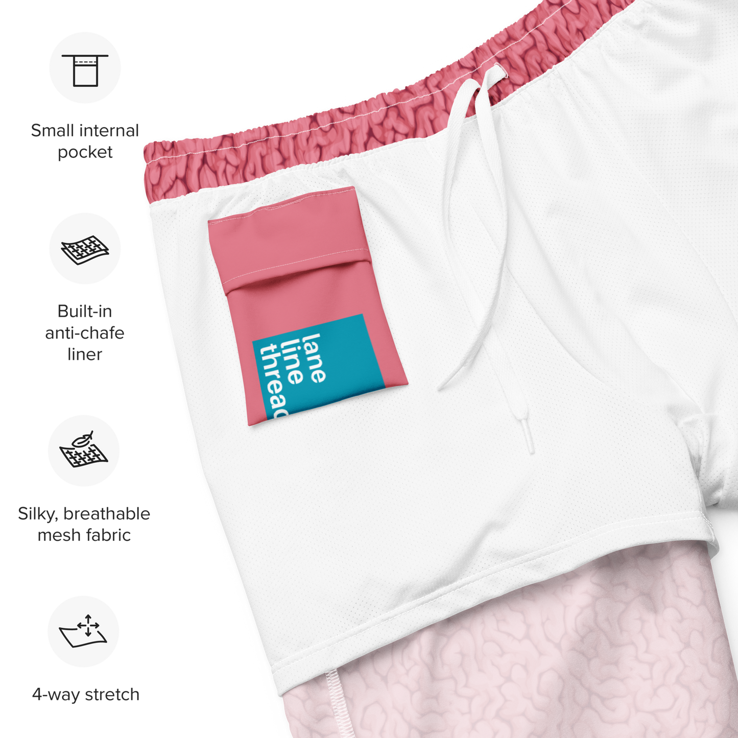 Inner white side of an organic swim trunks with pink waistband and mesh fabric, featuring a small internal pocket and anti-chafe liner.