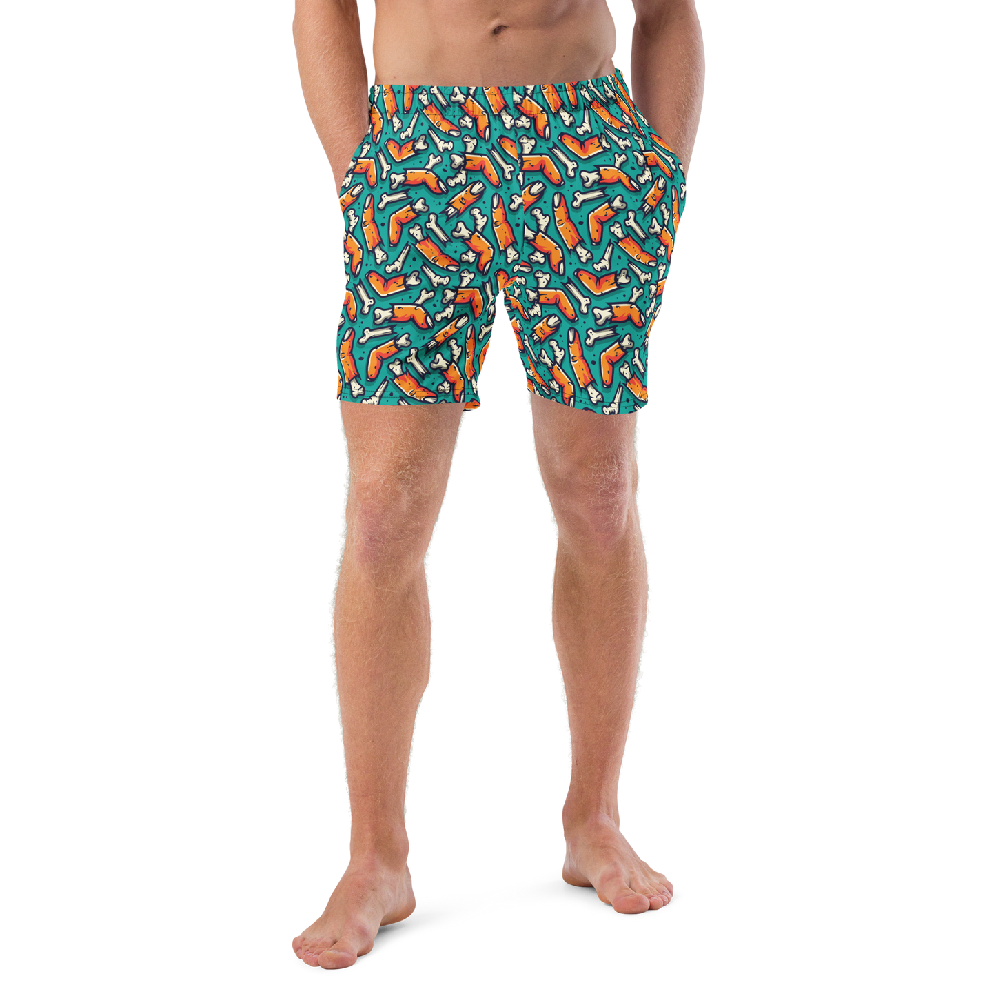 Person wearing colorful Halloween organic swim trunks with a zombie fingers pattern on a transparent background