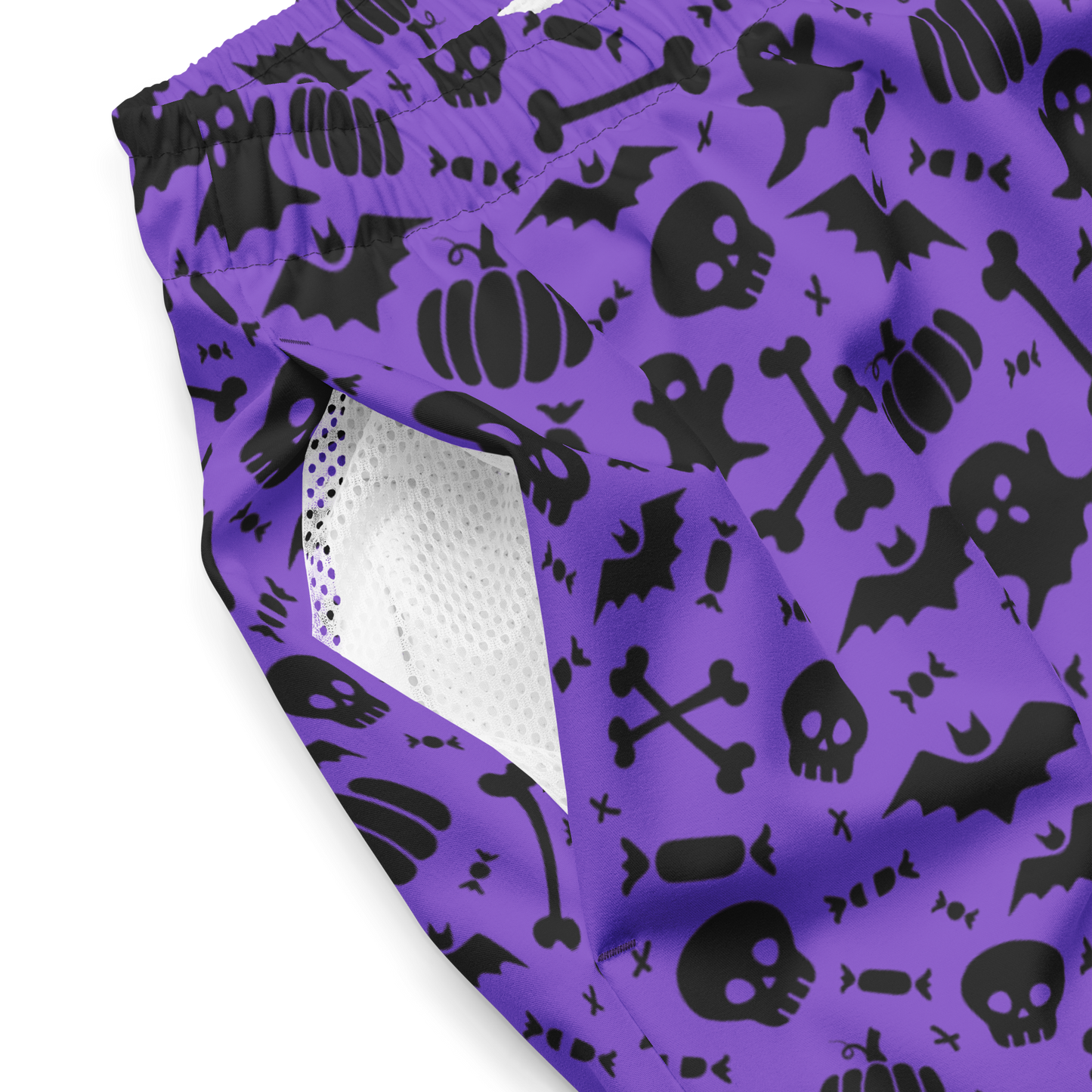 Purple swim trunks with black Halloween patterns on a white background