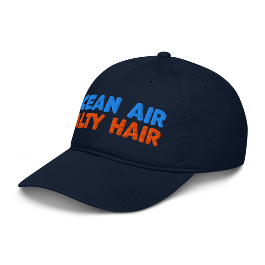 Navy blue cap with colorful text on a white background