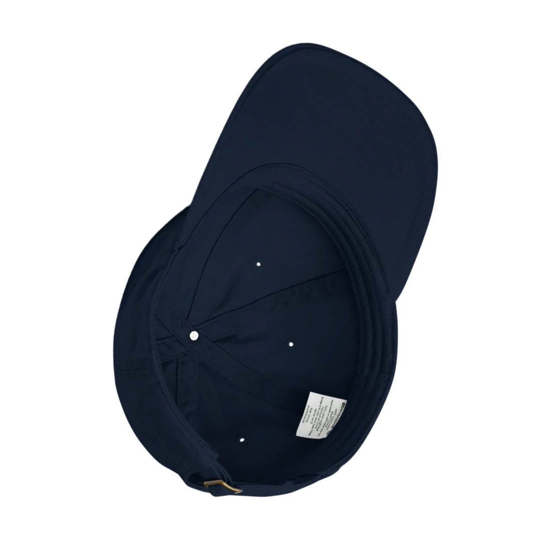 Navy blue organic cotton baseball cap with a visible brand label on a white background