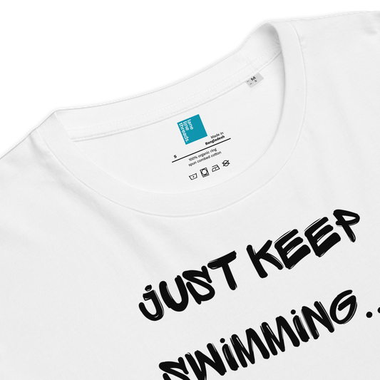 The front detailed look on the white organic funny swim shirt with a humorous swimmer design featuring two stick figure swimmers and the bold text “Just Keep Swimming… Away From My Lane!” Made from 100% organic cotton, this breathable and biodegradable shirt is perfect for competitive swimmers who value comfort, performance, and sustainability. Ideal gift for swim meets or lane-protecting athletes with a sense of humor.
