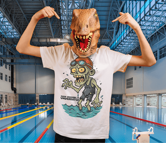 Person wearing an organic Halloween funny swim shirt with a pool zombie design in an indoor pool setting
