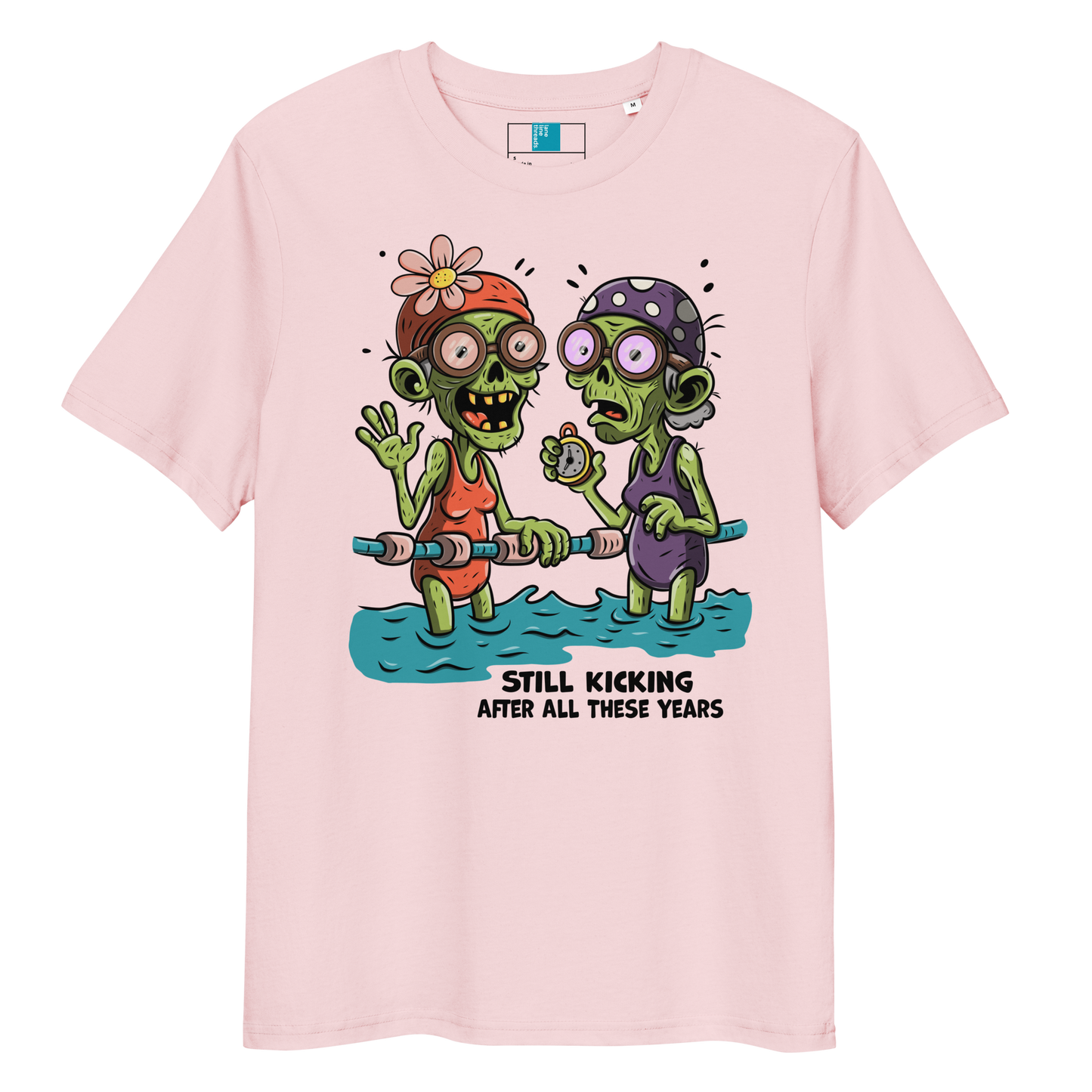 Pink organic cotton Halloween swim practice shirt with cartoon zombie swim besties holding lane line, text reads ‘still kicking after all these years'