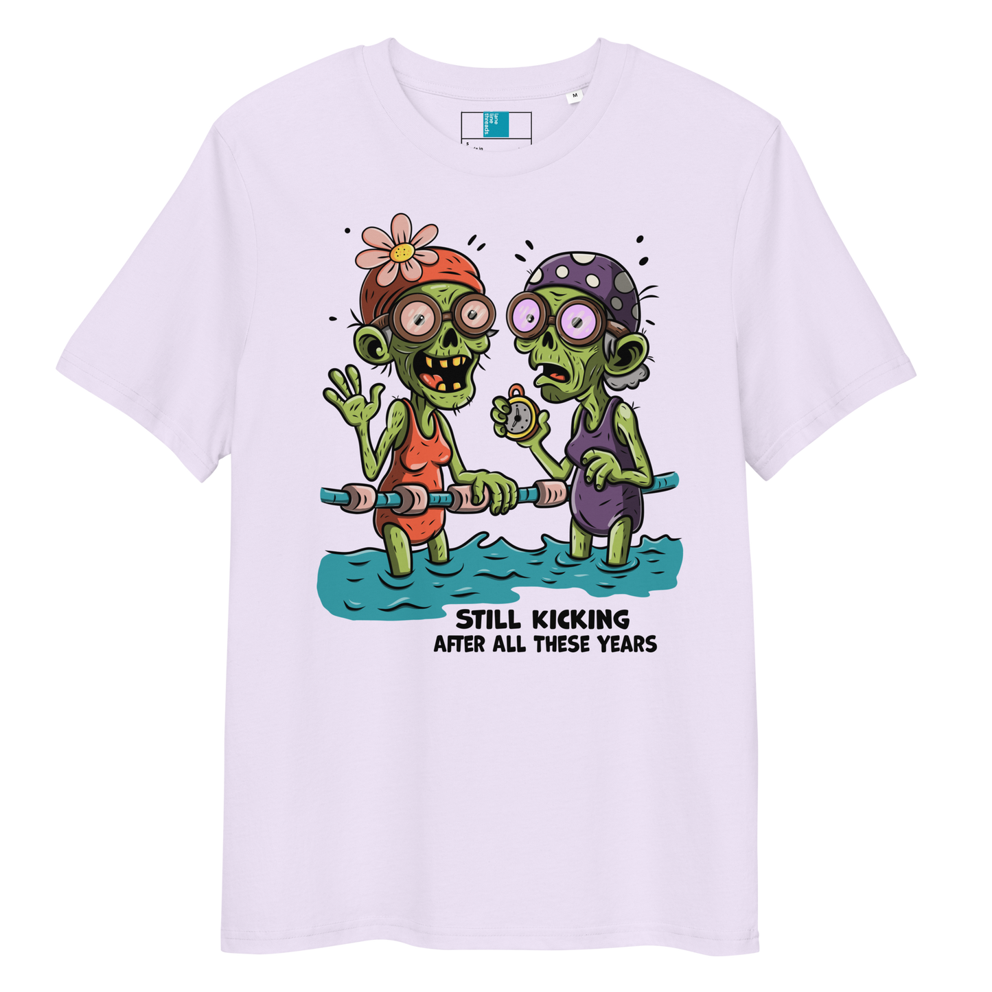 Lavender organic cotton Halloween swim practice shirt with cartoon zombie swim besties holding lane line, text reads ‘still kicking after all these years'
