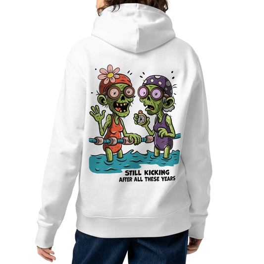 a female model from the back wearing an Organic hoodie in white with cartoon zombie swimmers and “Still Kicking After All These Years” Halloween graphic by Lane Line Threads, GOTS & OCS certified cotton.