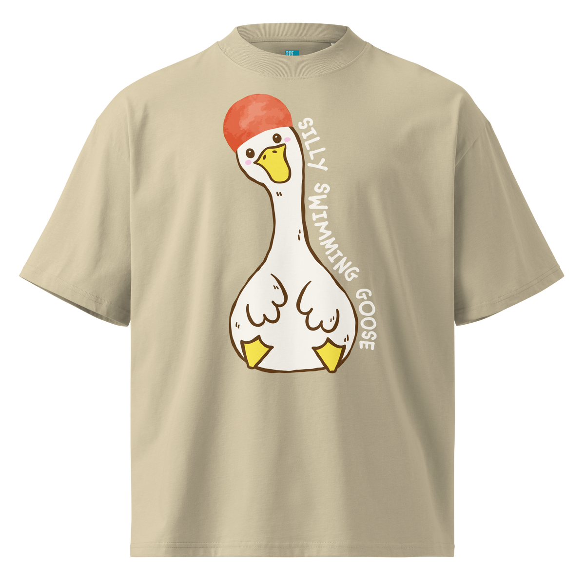 A beige short-sleeve organic oversized t-shirt by Lane Line Threads featuring a cartoon graphic of a white swimming goose wearing a red swim cap, with the text 'SILLY SWIMMING GOOSE' printed vertically alongside it.