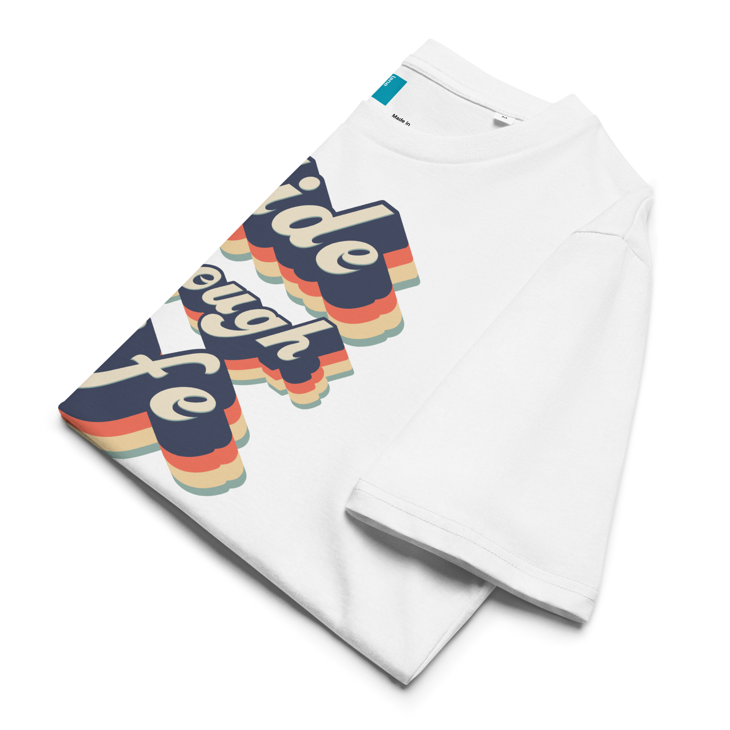 White folded organic swim shirt with colorful text