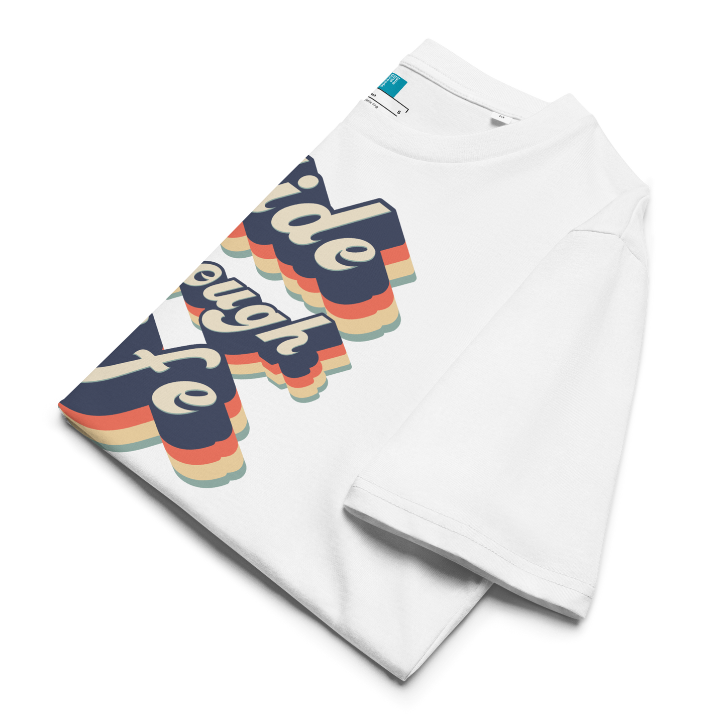 Folded white organic swim shirt with retro “Glide Through Life” text in bold navy, red, orange, and teal, made from 100% biodegradable organic cotton by Lane Line Threads.
