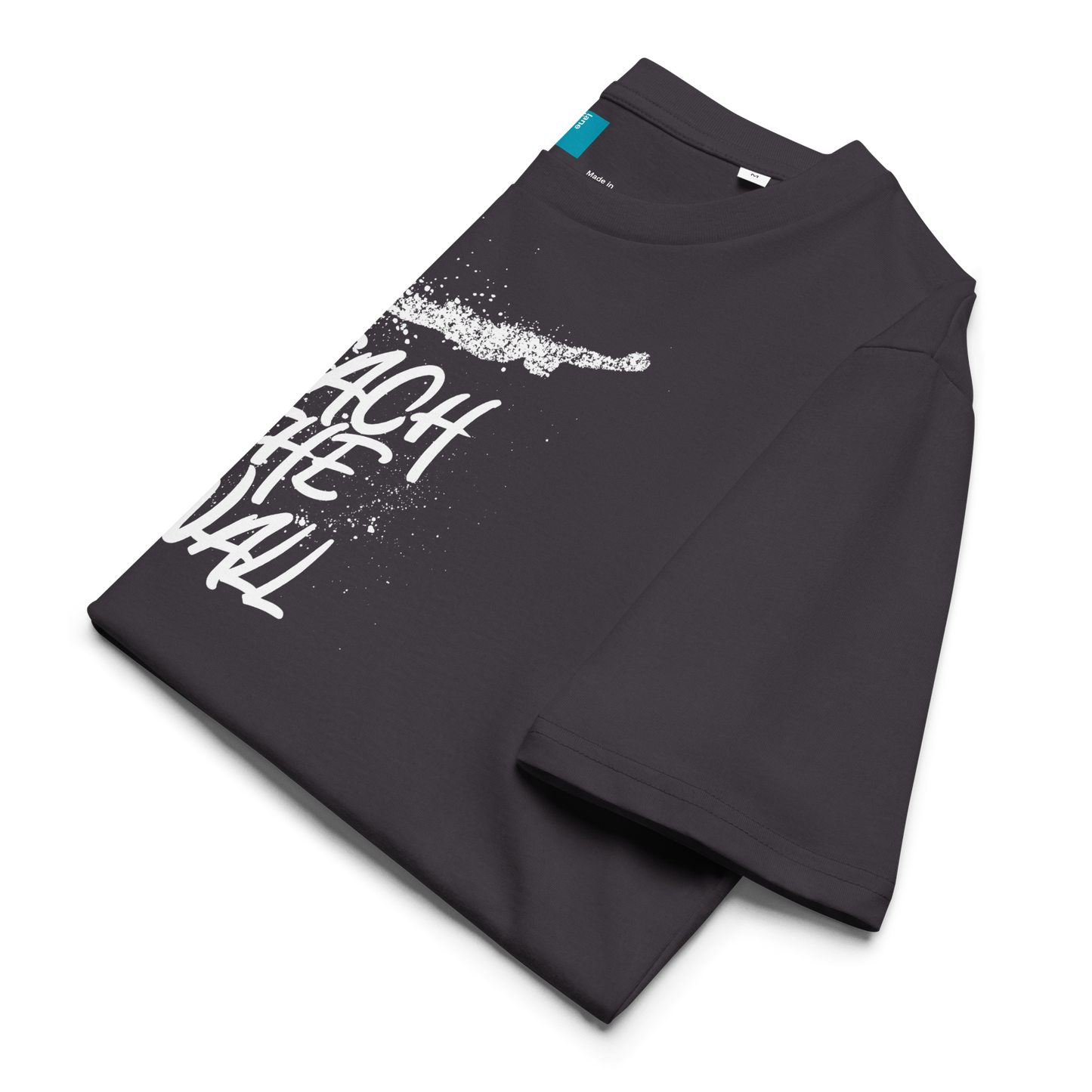 Folded anthracite organic swim shirt with bold white text “Reach the Wall” and swimmer graphic, eco-friendly shirt for swimmers and swim parents