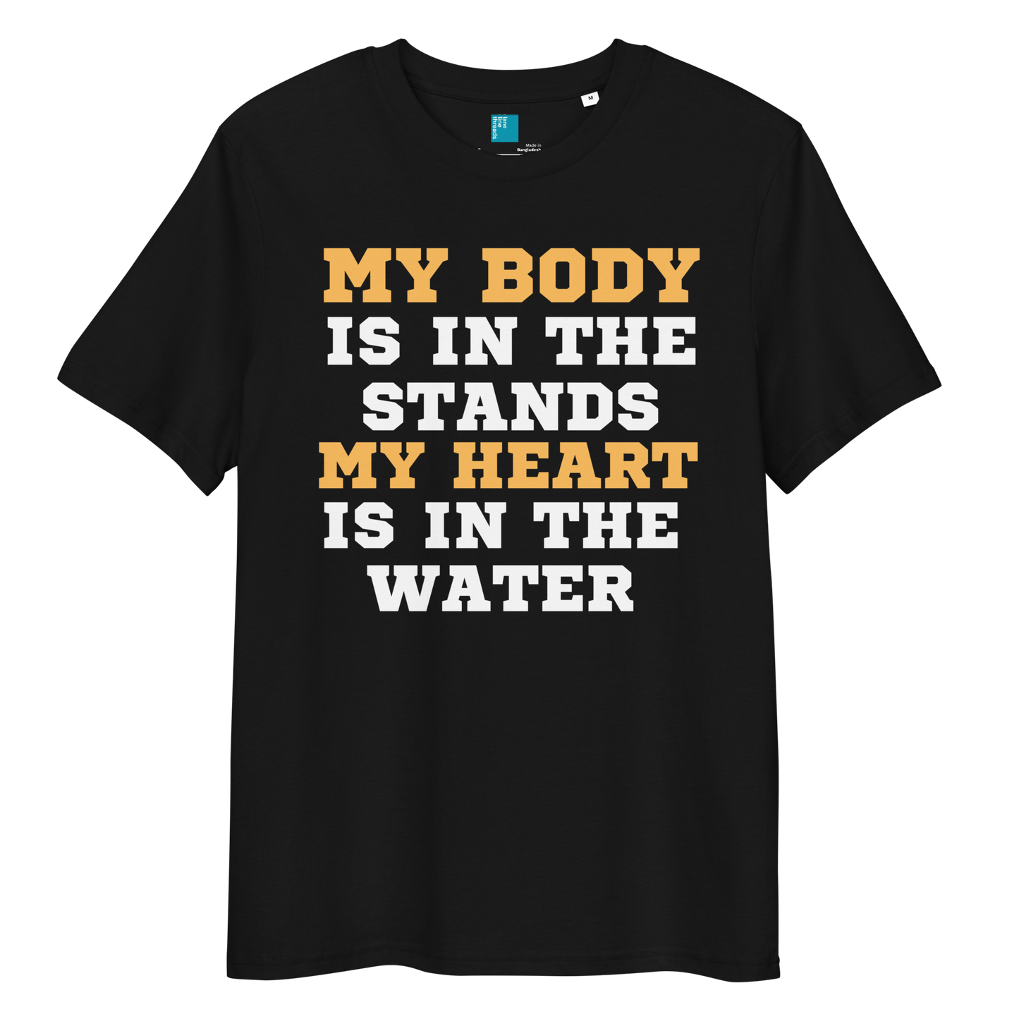 Black organic cotton swim mom t-shirt with bold text: “My Body Is in the Stands, My Heart Is in the Water,” displayed on transparent background