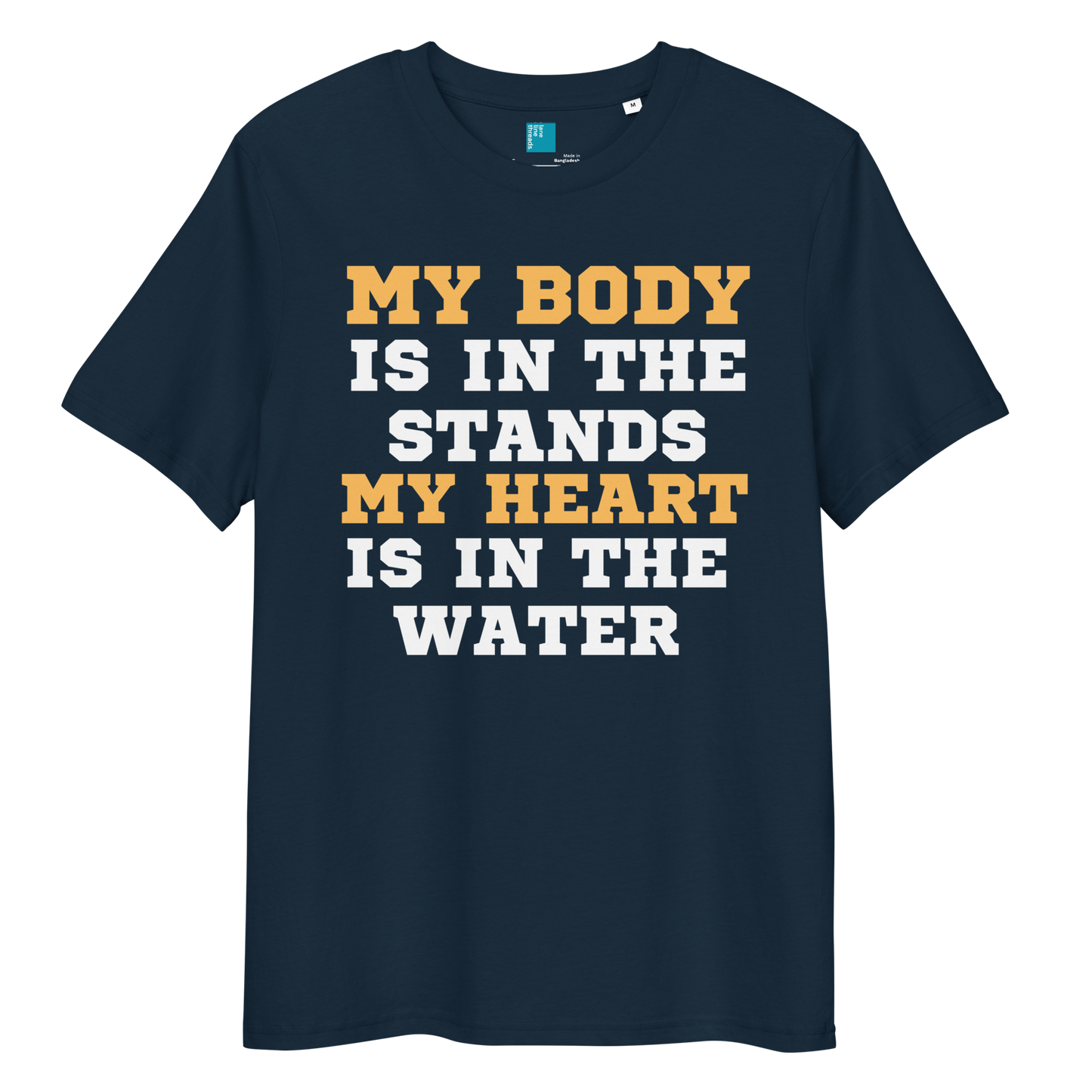 french navy organic cotton swim mom t-shirt with bold text: “My Body Is in the Stands, My Heart Is in the Water,” displayed on transparent background