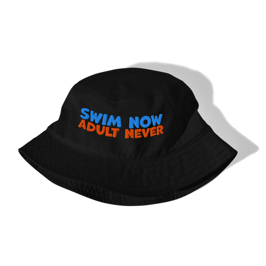 Eco-friendly organic bucket hat with 'Swim Now Adult Never' text, black, folded, for swim meets, made from sustainable materials.
