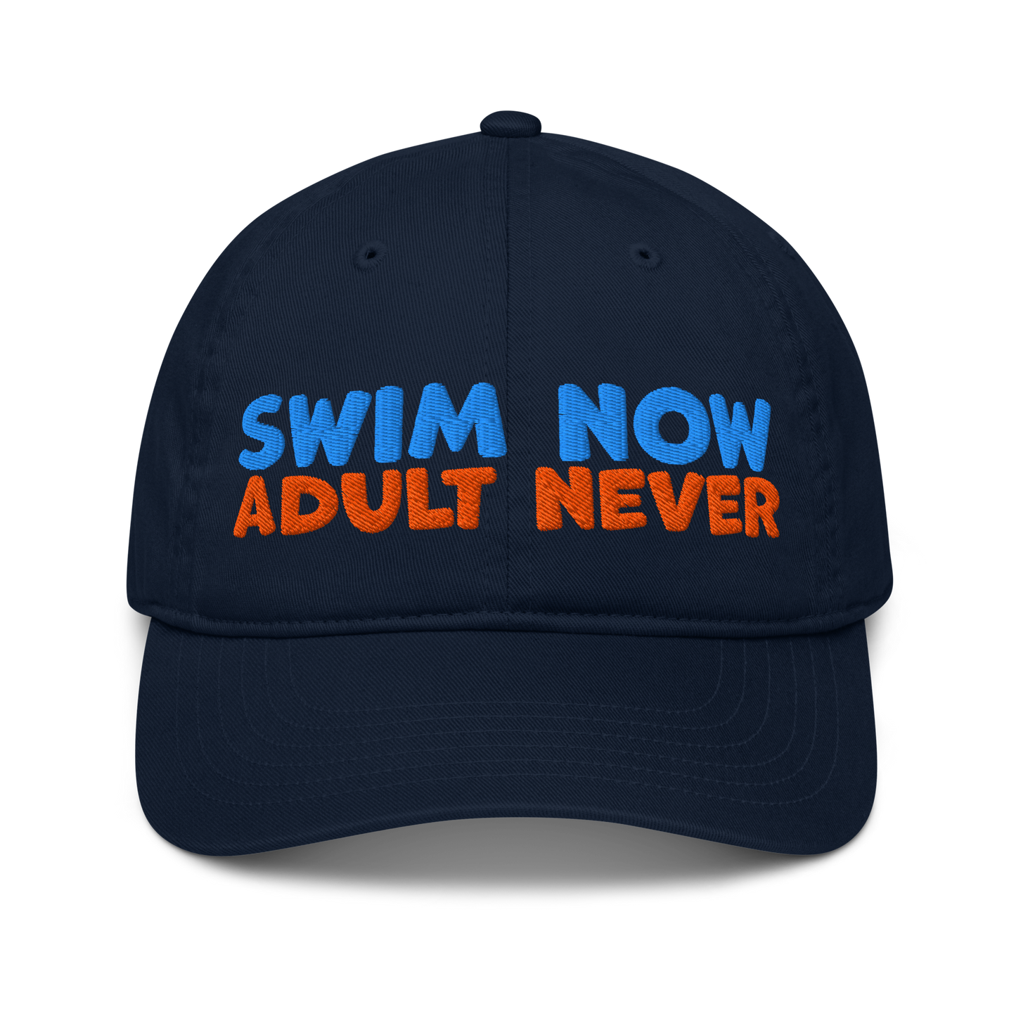 Navy blue organic cotton baseball cap with bold blue and orange embroidery reading “Swim Now, Adult Never.” Eco-friendly, vegan, and biodegradable.
