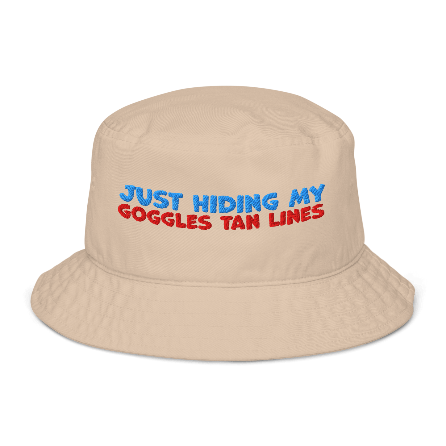 Beige organic bucket hat with blue and red embroidery reading “Just Hiding My Goggles Tan Lines.” Eco-friendly, breathable, and biodegradable swimmer hat.