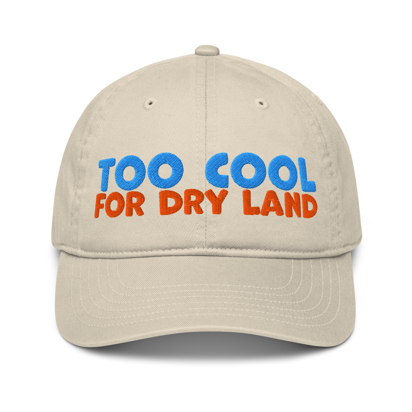 Beige organic cotton baseball cap embroidered with “Too Cool for Dry Land” in bold blue and orange text. Eco-friendly, breathable, and biodegradable.