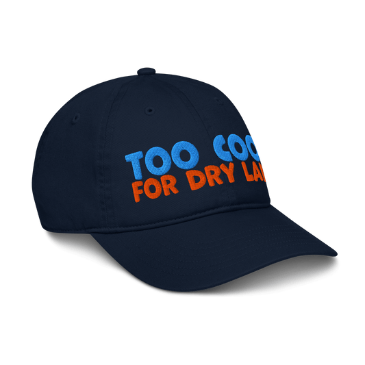 Side view of black organic baseball cap angled right, highlighting soft, curved brim and minimalist stitching. Made from sustainable, biodegradable cotton.