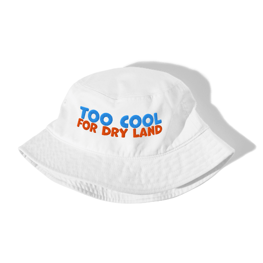 White organic cotton bucket hat for swimmers with "TOO COOL" in blue and "FOR DRY LAND" in orange embroidered text.
