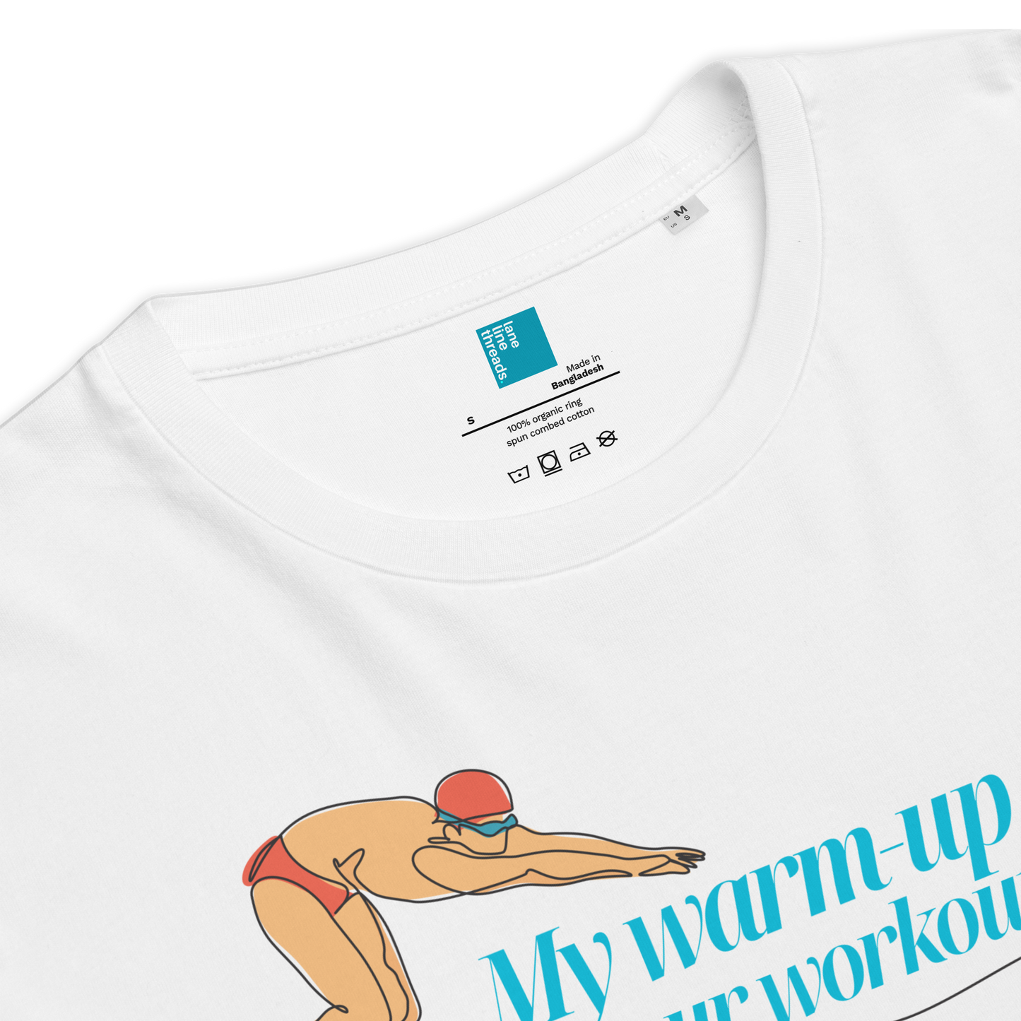 Close-up of organic swim shirt featuring swimmer graphic and text 'My warm-up is your workout'.