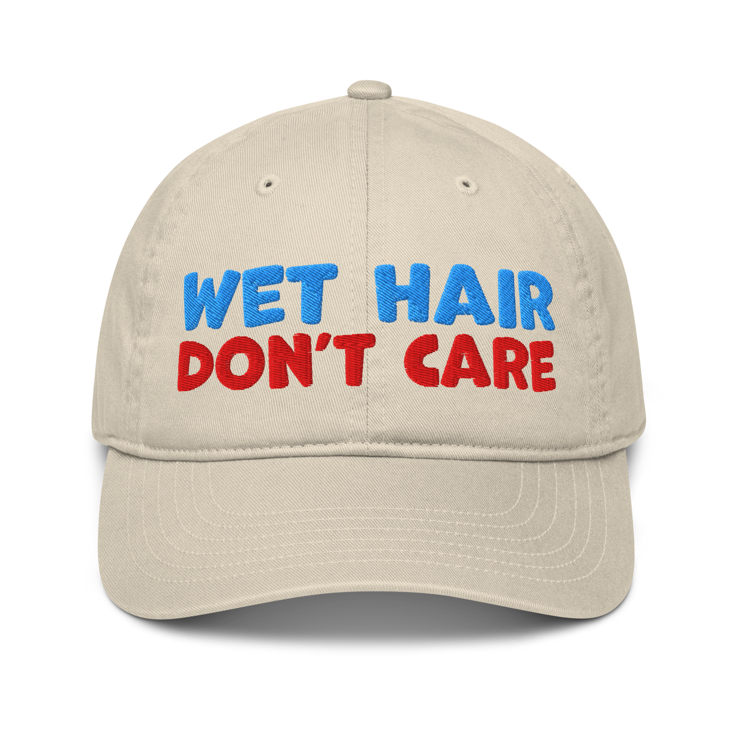 Beige organic baseball cap with curved brim, featuring minimalist embroidery "wet hair don't care" and made from 100% organic cotton. Eco-friendly, breathable, and ideal for swimmers.