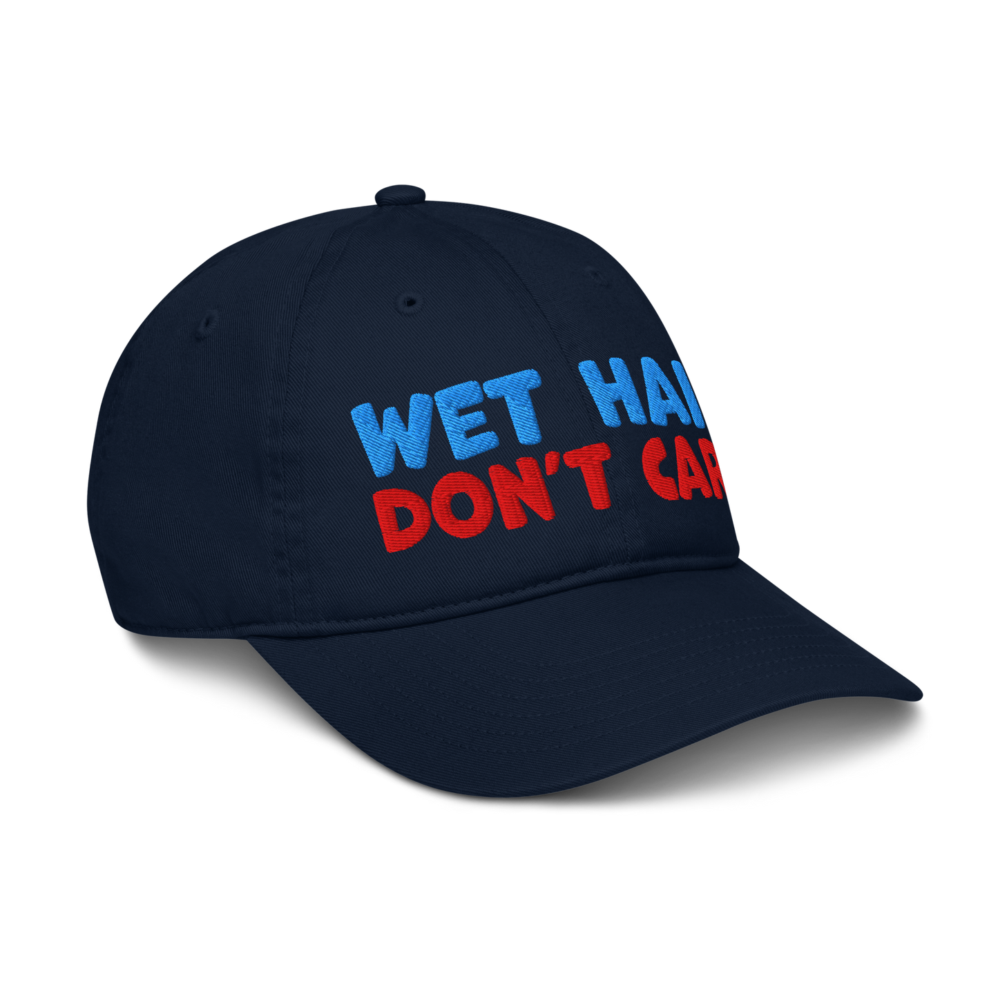 Navy blue cap with 'Wet Hair Don't Care' text in blue and red on a white background, turned right front.