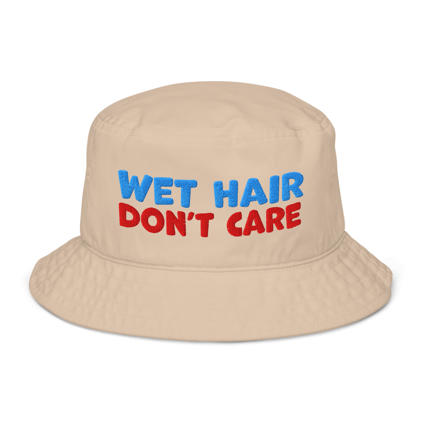 Beige organic cotton bucket hat with "WET HAIR" in blue and "DON'T CARE" in red embroidered text.