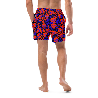 Person wearing colorful Halloween-patterned organic swim trunks on a transparent background
