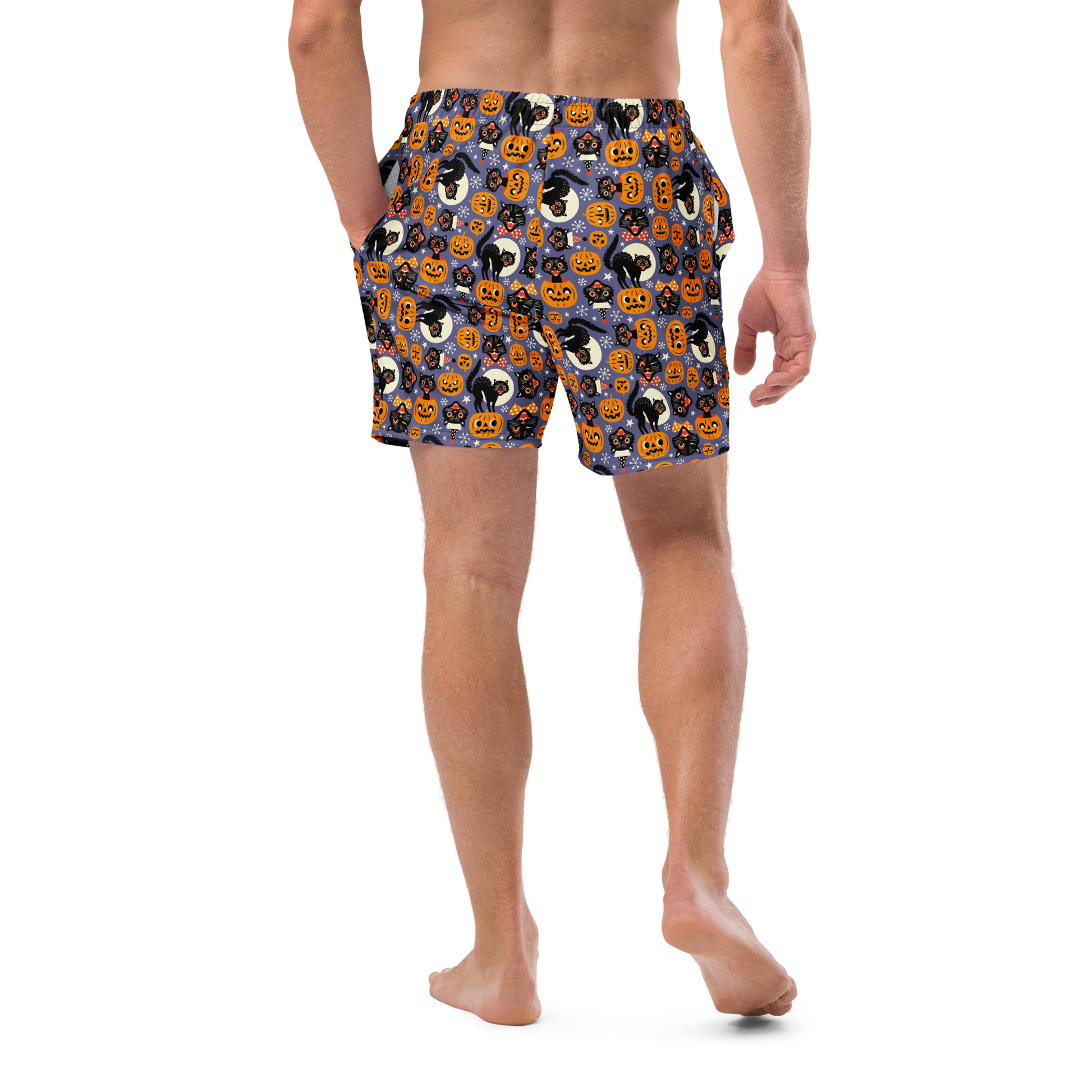 Person wearing Halloween-themed recycled swim trunks on a transparent background