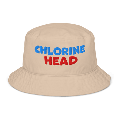 Beige organic bucket hat with bold red and blue “Chlorine Head” embroidery. Eco-friendly, breathable, biodegradable headwear for swimmers.
