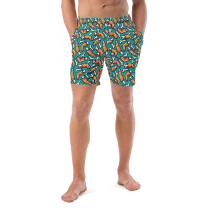 Person wearing colorful Halloween organic swim trunks with a zombie fingers pattern on a transparent background