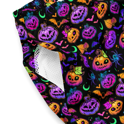 Halloween-themed organic swim trunks with colorful pumpkins and ghosts on a black background