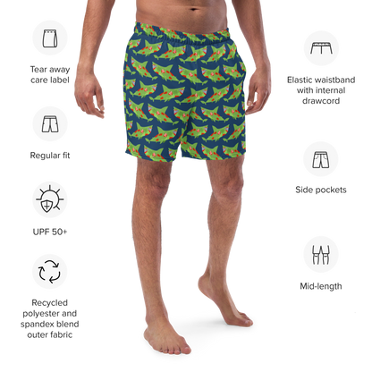 Person wearing shark-patterned Halloween organic swim trunks with product features listed on a white background