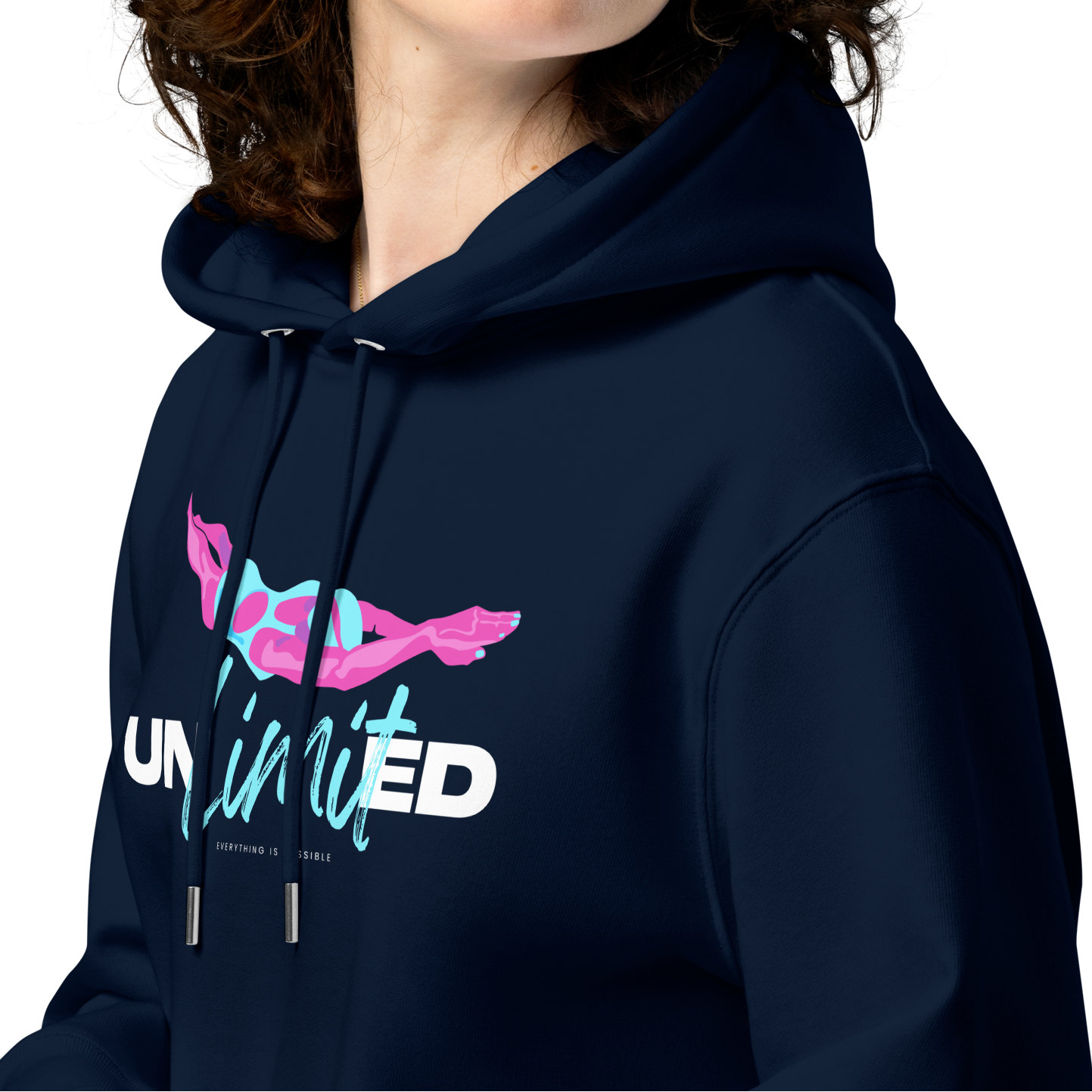 Person wearing a navy post‑swim organic hoodie with colorful “UNLimited – Everything Is Possible” graphic in pink, blue, and white; certified 100% cotton fabric ideal for swimmers after training