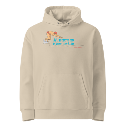 Front view of a beige organic hoodie for swimmers with a diving block graphic and teal script reading "My Warm-Up Is Your Workout" — Lane Line Threads Swim Nation