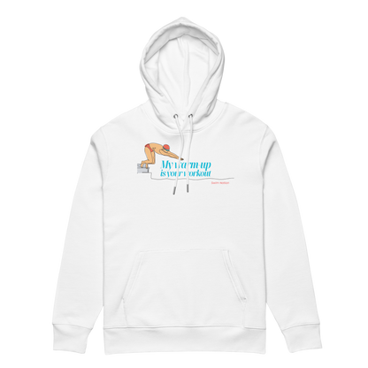 Front hood view of a white post swim organic hoodie with a diving block graphic and teal script reading "My Warm-Up Is Your Workout" — Lane Line Threads Swim Nation