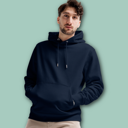 Man wearing a navy-blue swim parents' organic hoodie against a light green background