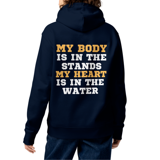 Person wearing a swim mom organic hoodie with bold gold and white varsity text reading "My Body Is In The Stands My Heart Is In The Water" — Lane Line Threads