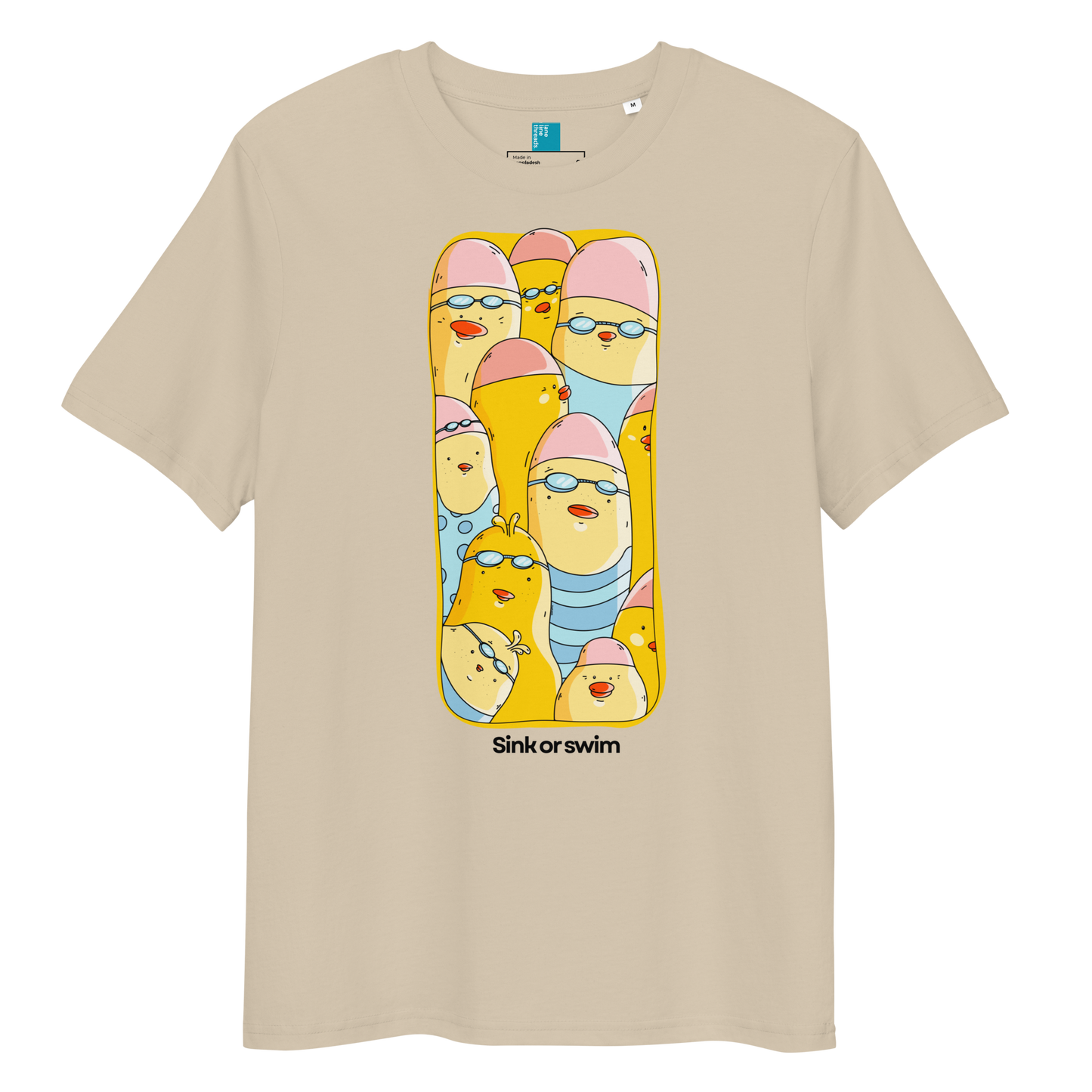 A beige short-sleeve crewneck organic cotton t-shirt featuring a colorful graphic print of cartoon birds in swimwear inside a yellow frame, with the text 'Sink or swim' printed below.
