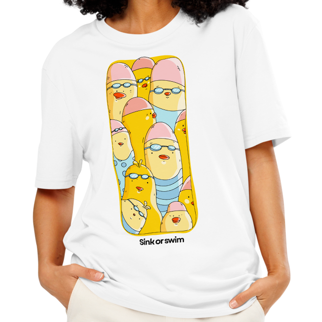 A woman modeling an organic cotton t-shirt white Lane Line Threads tee with colorful Sink or Swim cartoon swimmers in caps and goggles graphic, paired with cream wide-leg pants, against a plain white background.