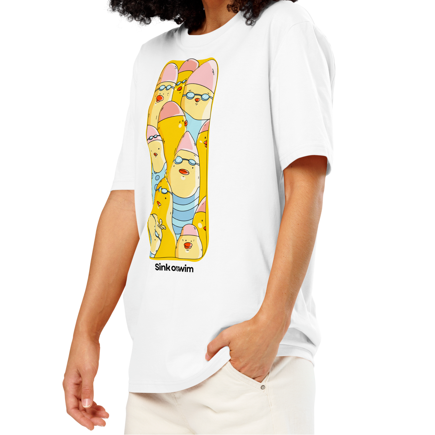 A woman with curly black hair wearing an organic cotton t-shirt white Lane Line Threads tee with colorful Sink or Swim cartoon swimmers in caps and goggles graphic.
