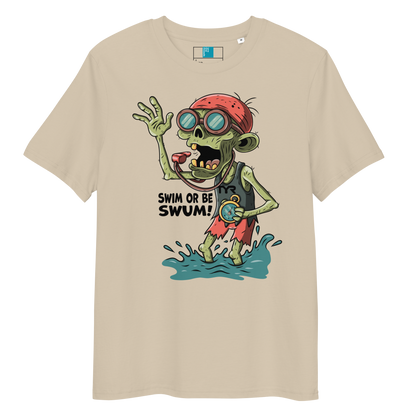 Beige organic cotton funny Halloween swimming coach shirt with cartoon zombie coach holding stopwatch and whistle, text reads ‘Swim or Be Swum!’"