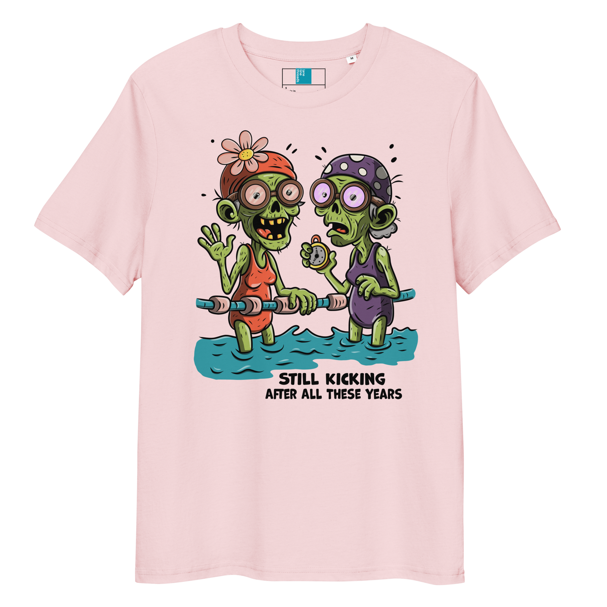 Pink organic cotton Halloween swim practice shirt with cartoon zombie swim besties holding lane line, text reads ‘still kicking after all these years'