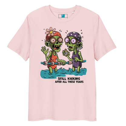 Pink organic cotton Halloween swim practice shirt with cartoon zombie swim besties holding lane line, text reads ‘still kicking after all these years'