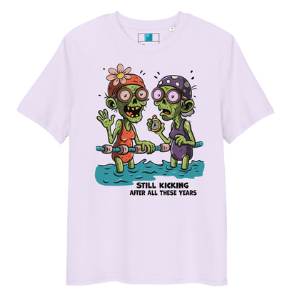 Lavender organic cotton Halloween swim practice shirt with cartoon zombie swim besties holding lane line, text reads ‘still kicking after all these years'
