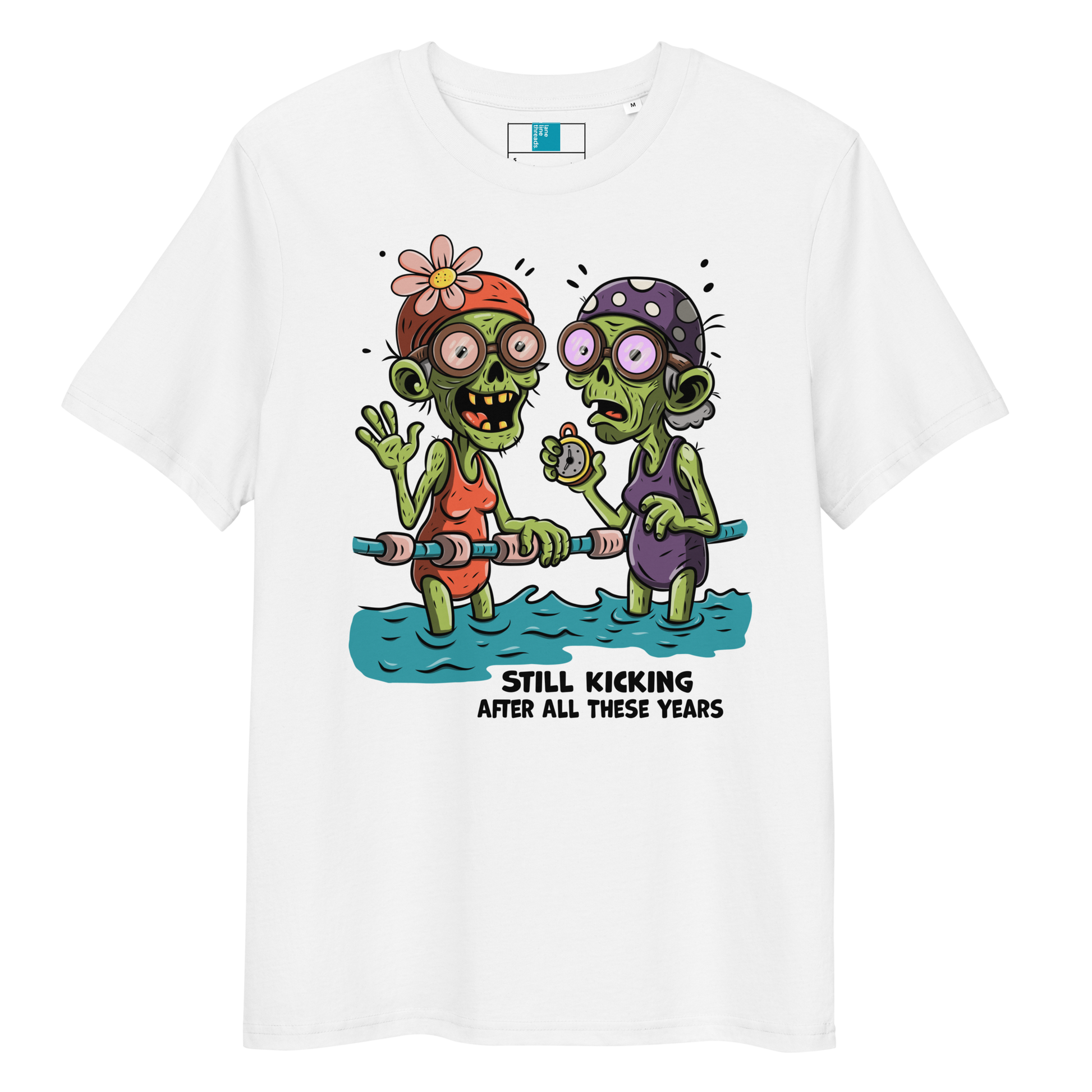 White organic cotton Halloween swim practice shirt with cartoon zombie swim besties holding lane line, text reads ‘still kicking after all these years'