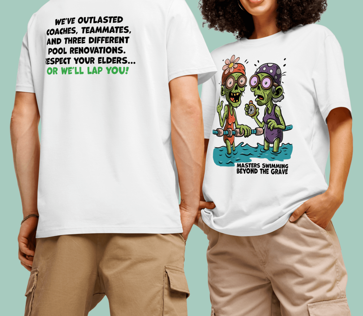 Two adults stand side by side wearing white Halloween swim-themed organic shirts. The shirt on the left shows bold back text: “WE'VE OUTLASTED COACHES, TEAMMATES, AND THREE DIFFERENT POOL RENOVATIONS. RESPECT YOUR ELDERS... OR WE'LL LAP YOU!” The shirt on the right displays a colorful cartoon of two zombie-like swimmers in goggles and suits, one holding a pool noodle, with the caption “MASTERS SWIMMING BEYOND THE GRAVE.” The image playfully celebrates veteran swimmers’ endurance with spooky humor.