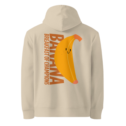 Organic hoodie in beige by Lane Line Threads with a smiling banana and "Banana Breakfast Champion" text graphic, made from GOTS and OCS certified organic cotton.